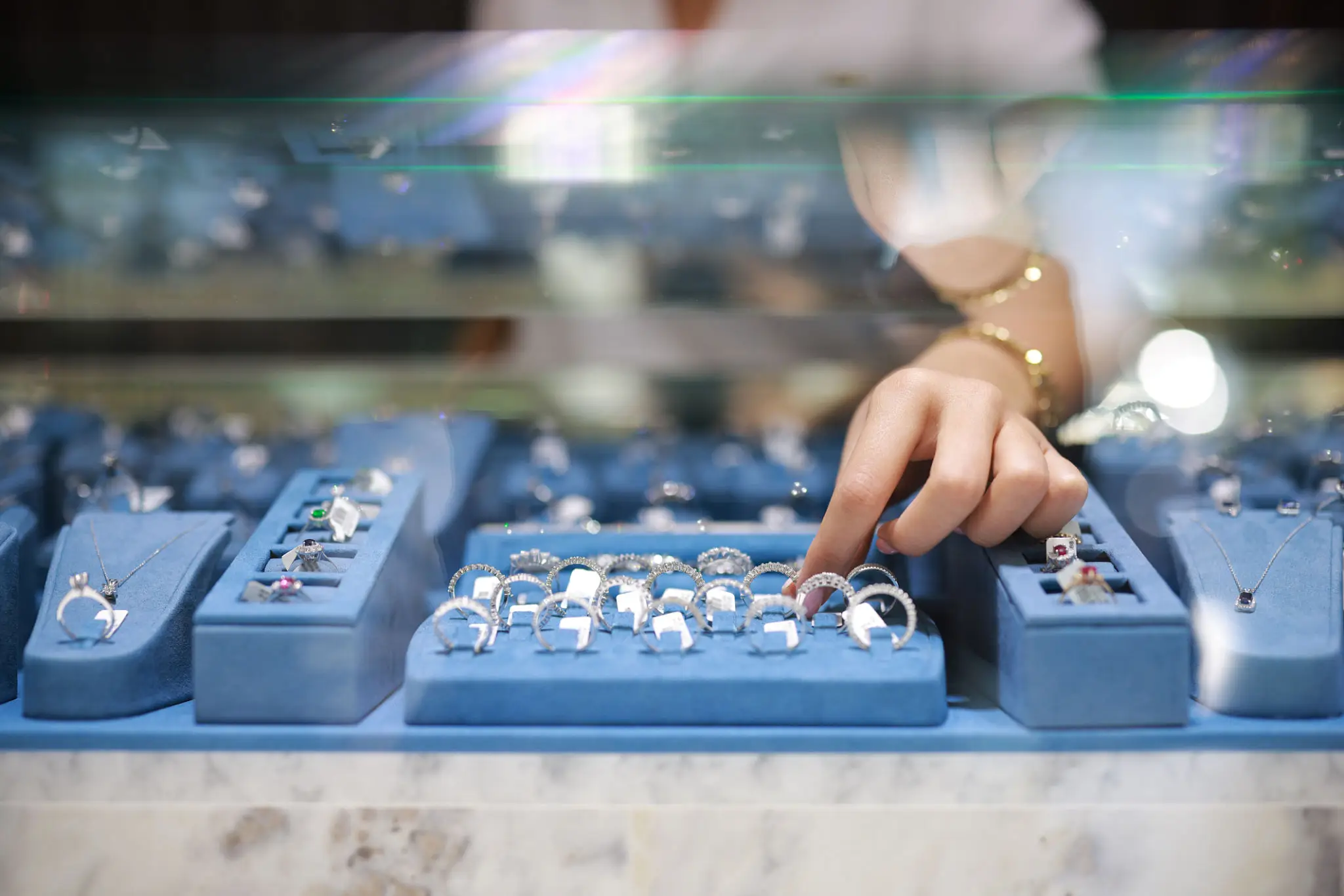 Silver buying expert inspecting silver jewelry in Victor, NY.