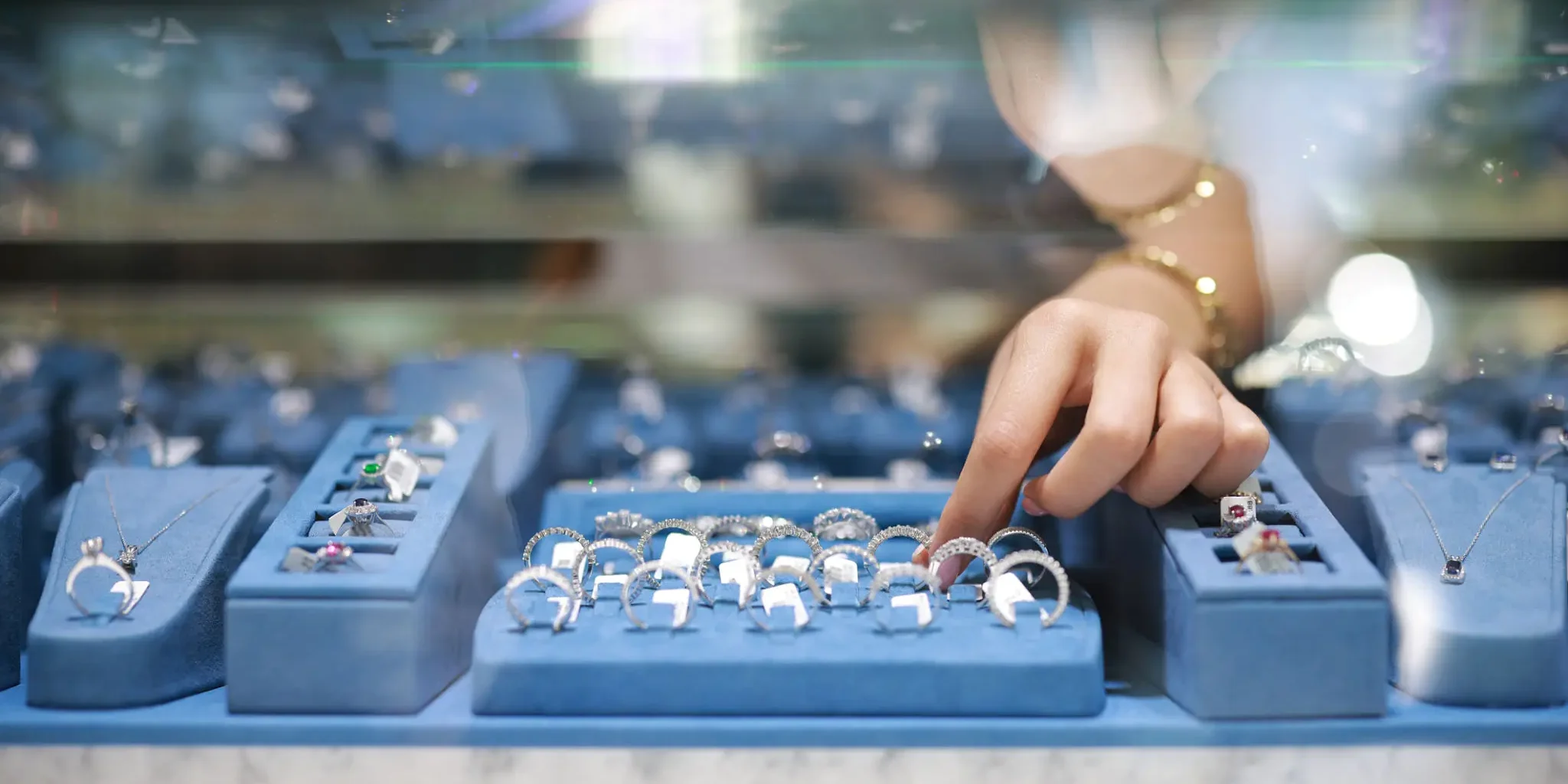 Silver buying expert inspecting silver jewelry in Victor, NY.